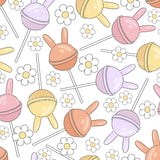 a repeating pattern of colorful lollipops and flowers on a white background.