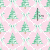 a watercolor christmas tree with a bow on a pink background