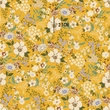 a yellow background with flowers and leaves