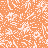 an orange and white pattern with leaves and dots