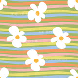 a colorful striped pattern with flowers on it