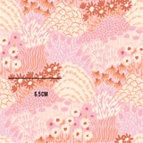 a pink and brown floral pattern with a ruler