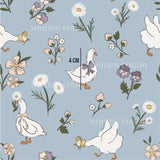 a blue background with white ducks and flowers
