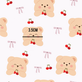 a teddy bear with cherries and a measuring tape
