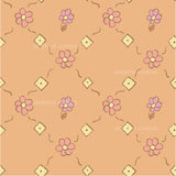 a pink flower pattern on an orange background