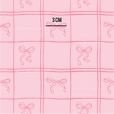 a pink background with bows on it