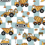 a pattern of construction vehicles on a checkered background