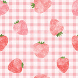 a pattern of strawberries on a pink and white checkered tablecloth