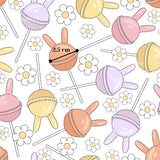 a repeating pattern of colorful lollipops and flowers on a white background.