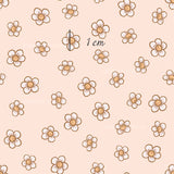 a pink background with brown flowers on it