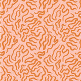 an orange and pink pattern on a pink background