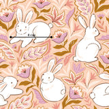 a repeating pattern of white rabbits surrounded by pink and orange flowers and leaves.