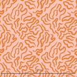 a pink and orange background with a pattern of wavy lines