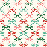 a pattern of bows on a white background