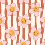 a repeating pattern of pink and white flowers with smiling faces, creating a cheerful and whimsical design.