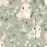 a repeating pattern of cartoon rabbits surrounded by white flowers and greenery. The rabbits are depicted in various poses, and the background is a light green color with white flowers scattered throughout. The image is a collage of multiple images, and the text "sitten cotton" is visible, likely indicating the source or creator of the pattern.