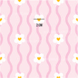 a pink and yellow pattern with hearts on it