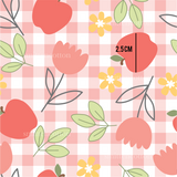 a pattern of apples and flowers on a checkered background