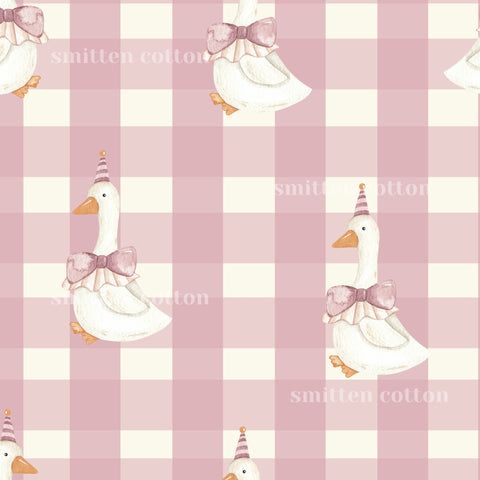 a repeating pattern of white ducks wearing party hats and bow ties against a pink and white checkered background.
