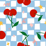 a pattern of red cherries and stars against a blue and white checkered background.