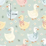 a repeating pattern of cartoon-style ducks with bows on their necks, set against a light blue background with white flowers.