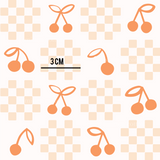 a pattern of cherries on a checkered background