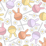a repeating pattern of colorful lollipops and flowers on a white background.