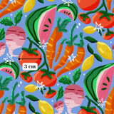 The image is a vibrant and colorful pattern featuring various fruits and vegetables, including watermelon, carrots, lemons, and radishes, all set against a bright blue background.