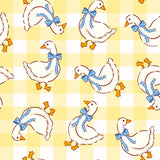 a repeating pattern of white ducks with blue bows on their necks, arranged in a grid-like pattern against a yellow background.