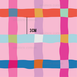 a pink and blue checkered pattern with the word 3cm