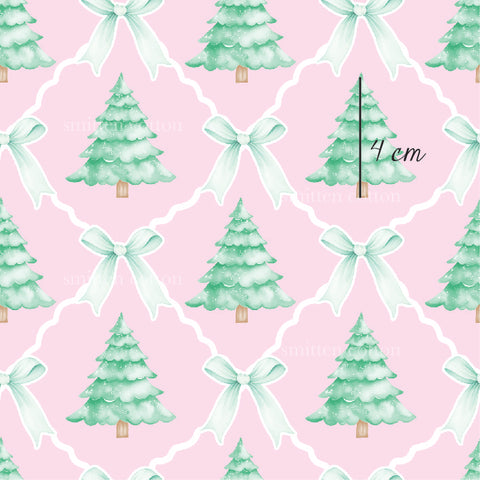 a watercolor christmas tree with a bow on a pink background