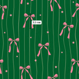 pink bows and stars on a green background.