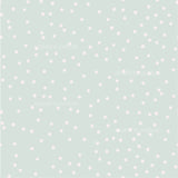 a light green background with white polka dots