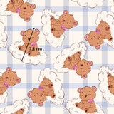 a repeating pattern of cartoon teddy bears sitting on clouds, with a measurement scale indicating their size.