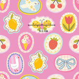 a variety of colorful and whimsical illustrations, including a bird, a butterfly, a lemon, a strawberry, a bow, and other playful elements, all set against a pink background.
