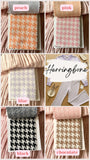 The image is a collage of six fabric swatches, each with a different color and pattern, showcasing various houndstooth designs.