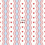 a repeating pattern of red hearts on a white background, with a measurement scale in the center indicating the size of the pattern.