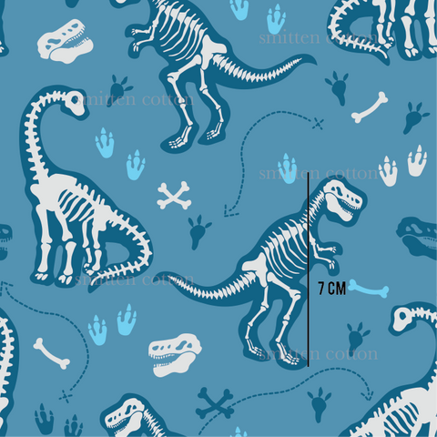 a blue and white dinosaur pattern on a blue background