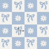 The image is a pattern of blue squares with white flowers and blue bows. The squares are arranged in a grid-like pattern, and there is a single square with a measurement of 2 cm in the center.