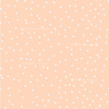 a white polka dot pattern on a peach background