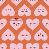 a pattern of hearts with faces on a pink background
