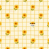 a repeating pattern of yellow sunflowers on a white background, with a small black line indicating the size of the pattern.