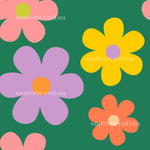 four large, stylized flowers in various colors including pink, purple, yellow, and orange against a green background.
