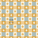 a repeating pattern of yellow and white flowers on a light blue background, with a measurement line indicating the size of the pattern.