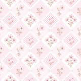 The image is a seamless pattern featuring a repeating design of pink flowers and hearts on a white background.
