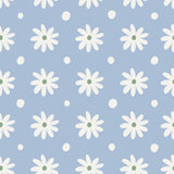 a repeating pattern of white daisy flowers against a light blue background with small white dots scattered throughout.