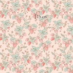 a pink background with green leaves and strawberries