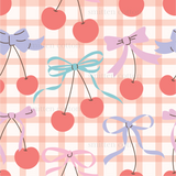 a gingham checkered pattern with cherries and bows