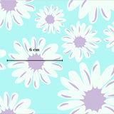 a pattern of white and purple flowers against a light blue background.