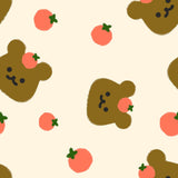 a repeating pattern of brown bear faces with orange spots and green leaves, along with small orange circles scattered throughout the background.